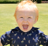 smiling-redhaired-boy-home-button